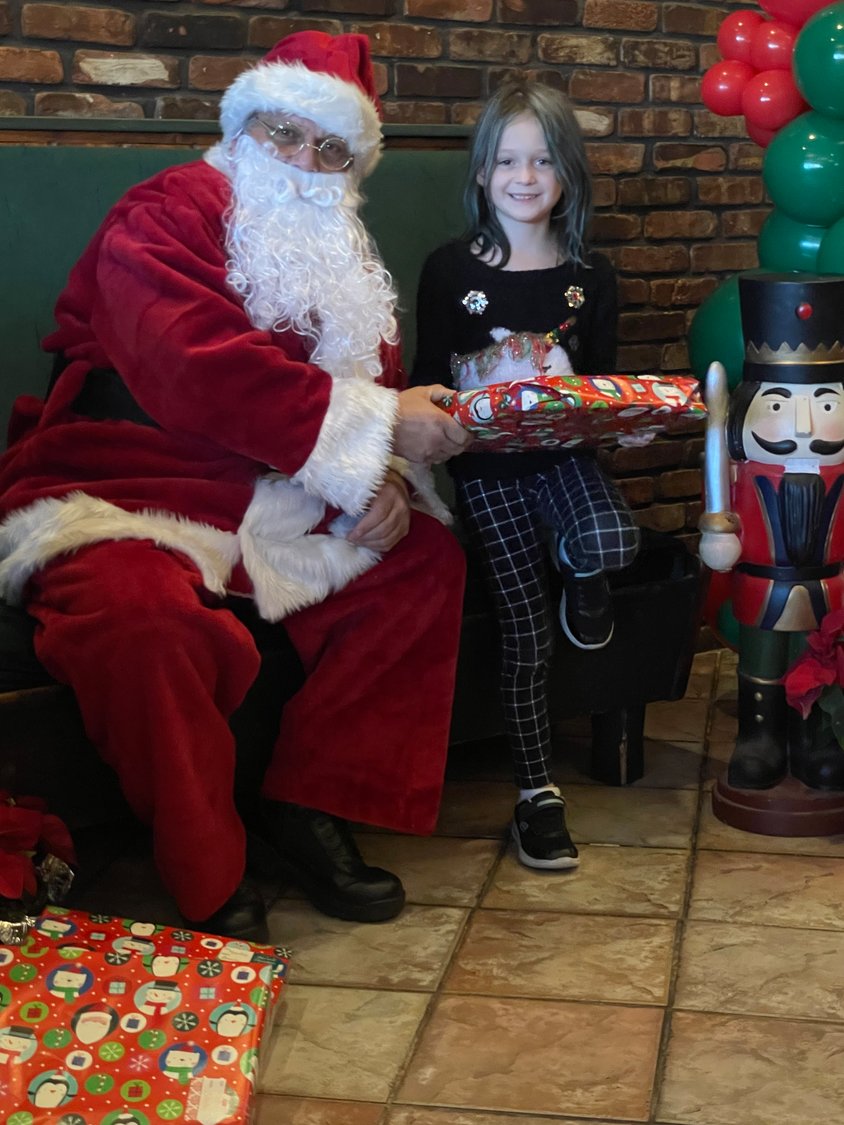 Sophia Vardakis, 7, received a special present from Santa at the breakfast on Dec. 4.
